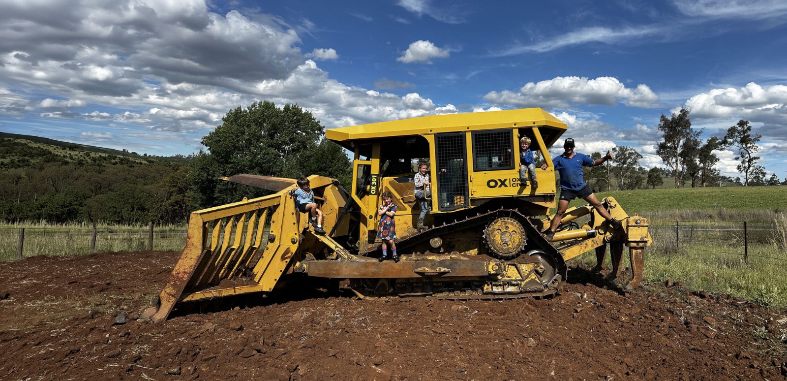 Dozer on a development site under a clear sky
