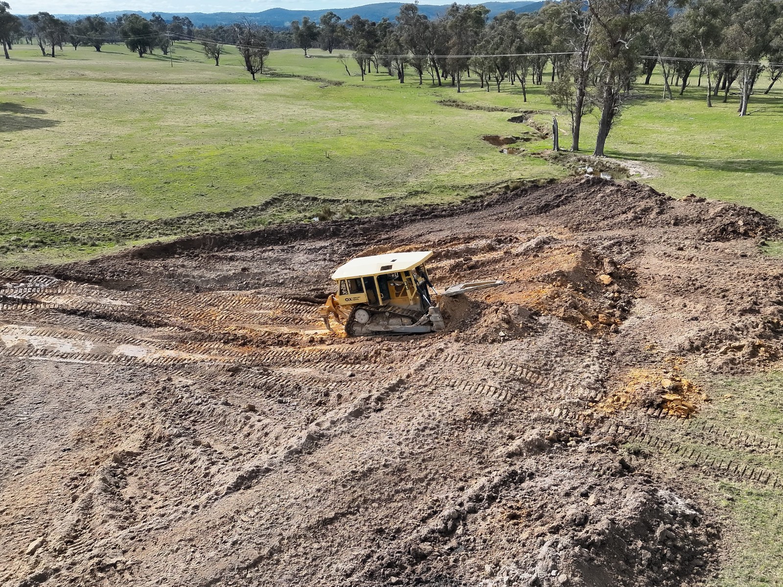 Dozer shaping a farm dam