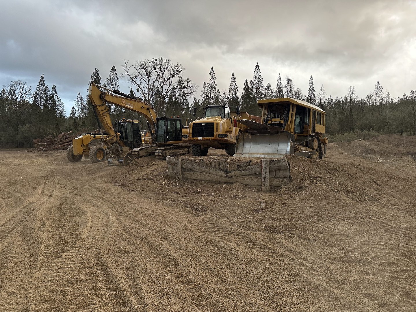 Grader and dump truck on site
