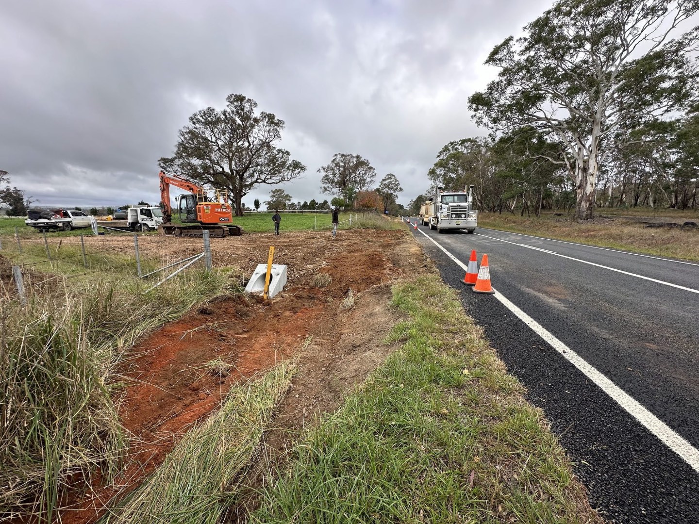 Excavator cutting a table drain