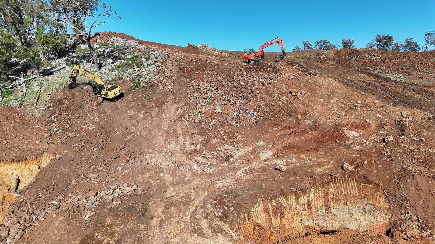 Excavators working the slope