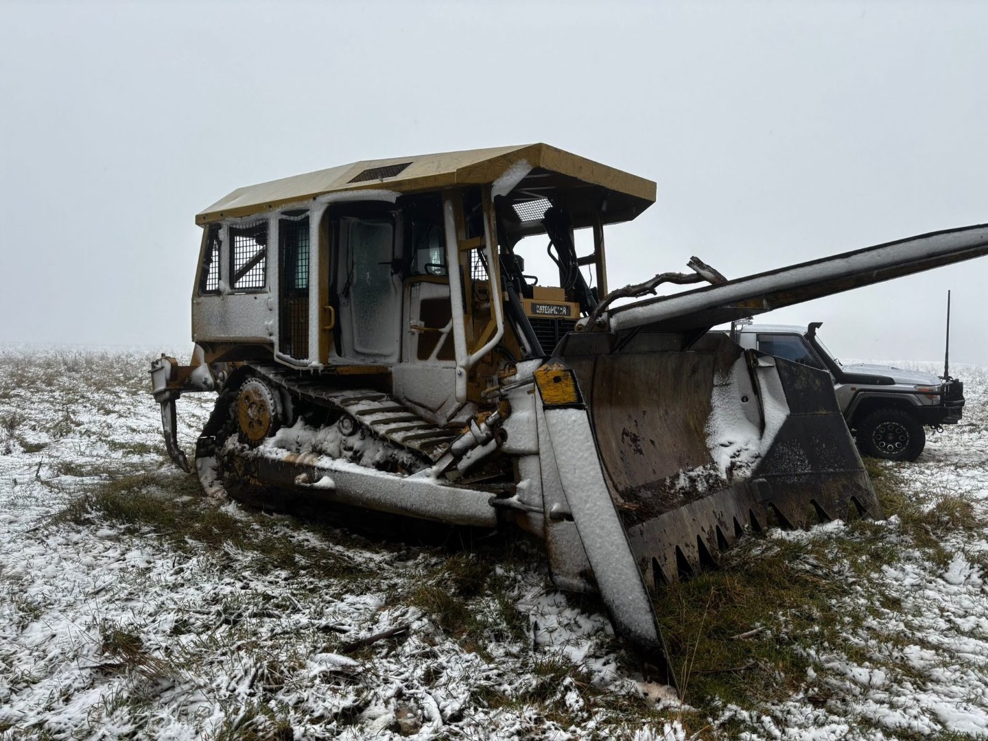 Dozer in the snow on the Tablelands