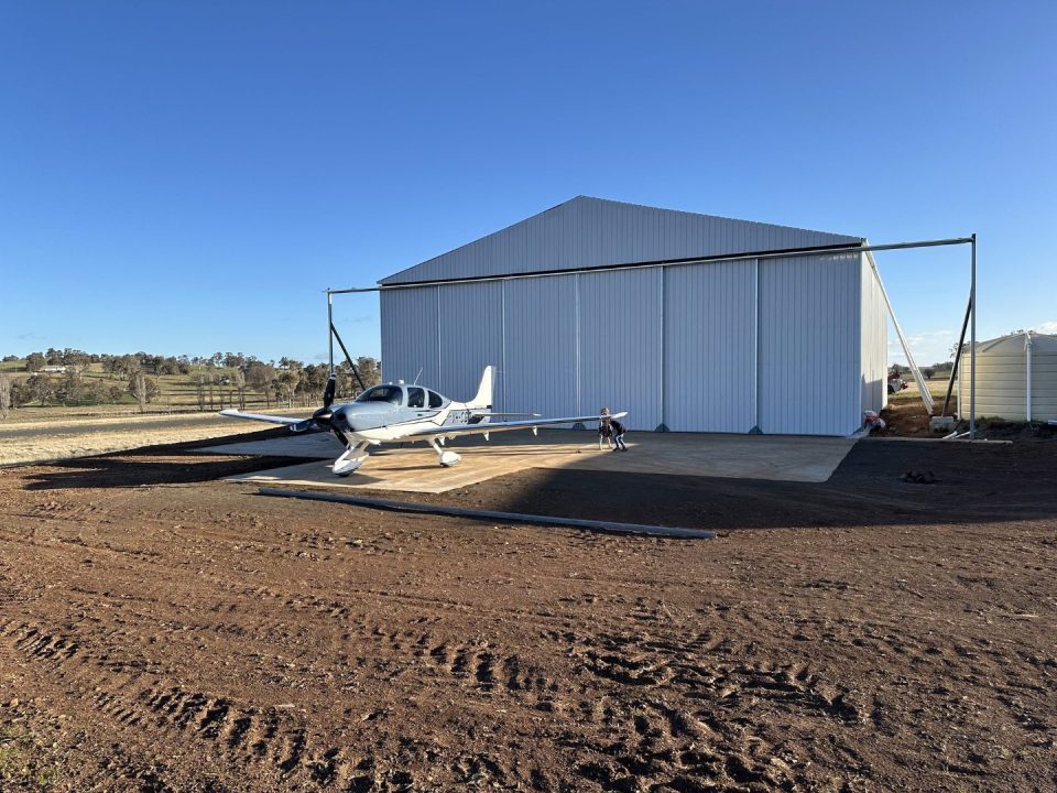 Completed hangar with aircraft on the apron