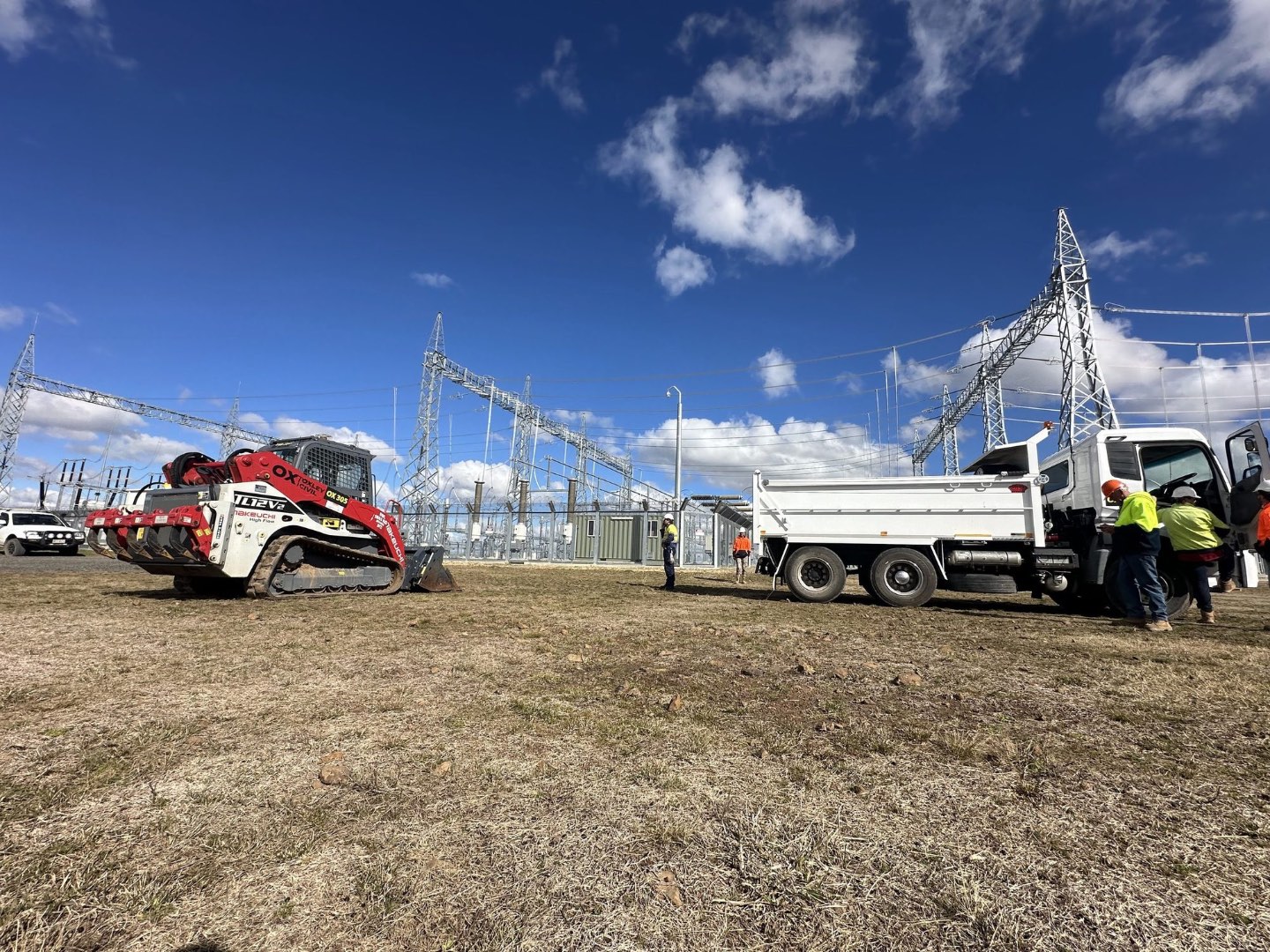 Crew and tipper inside the substation compound