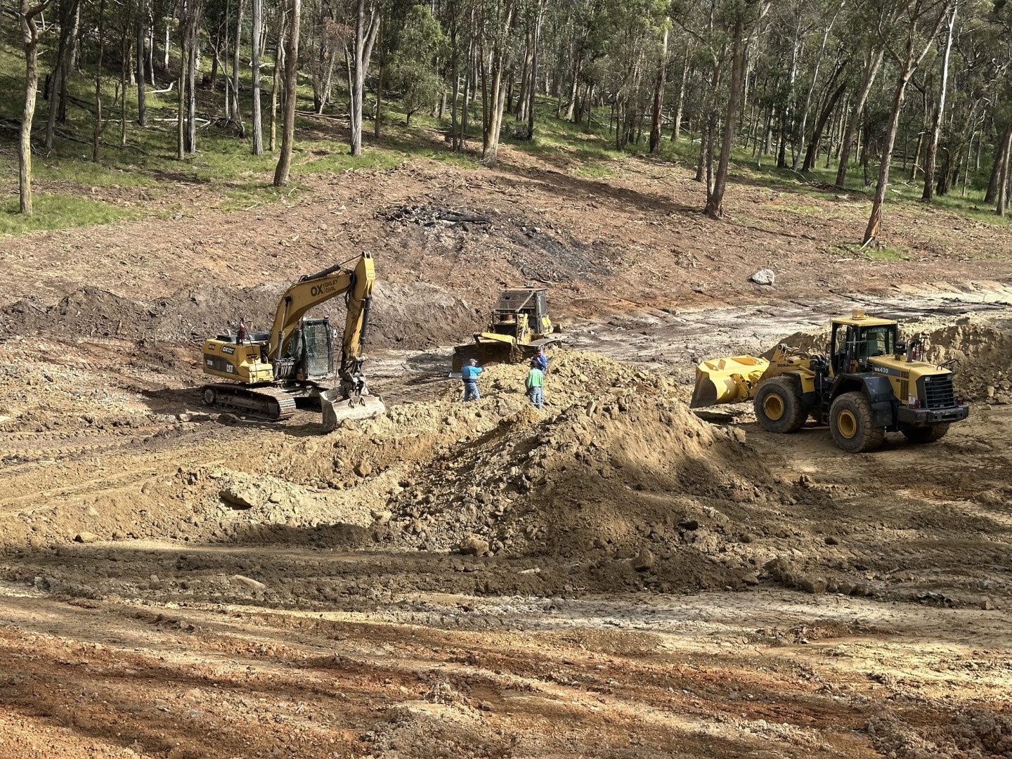 Excavator, dozer and loader on a cleared bush site