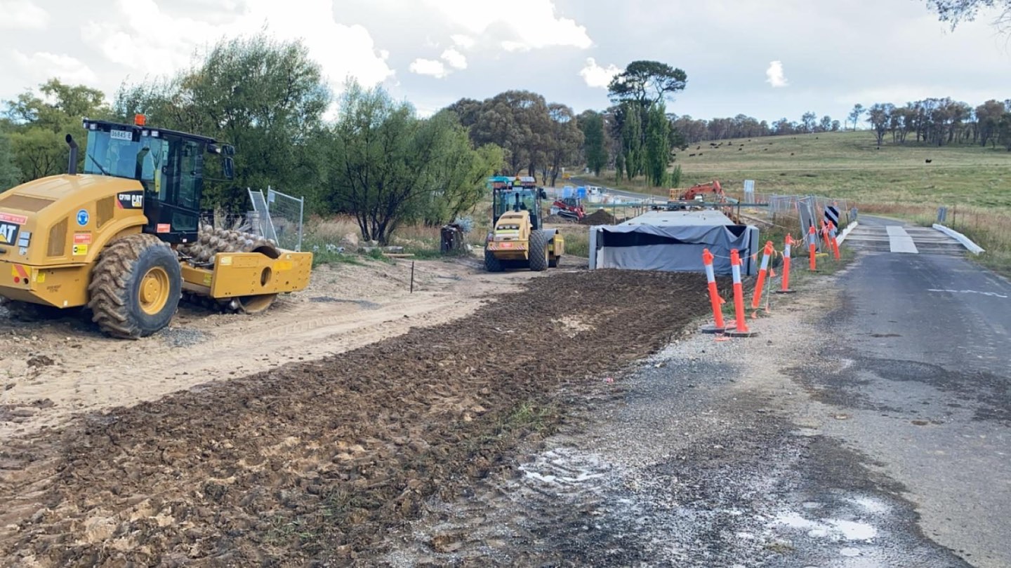 Rollers compacting the widened approach