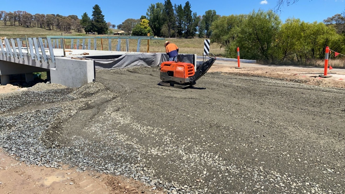Compacting the bridge approach pavement