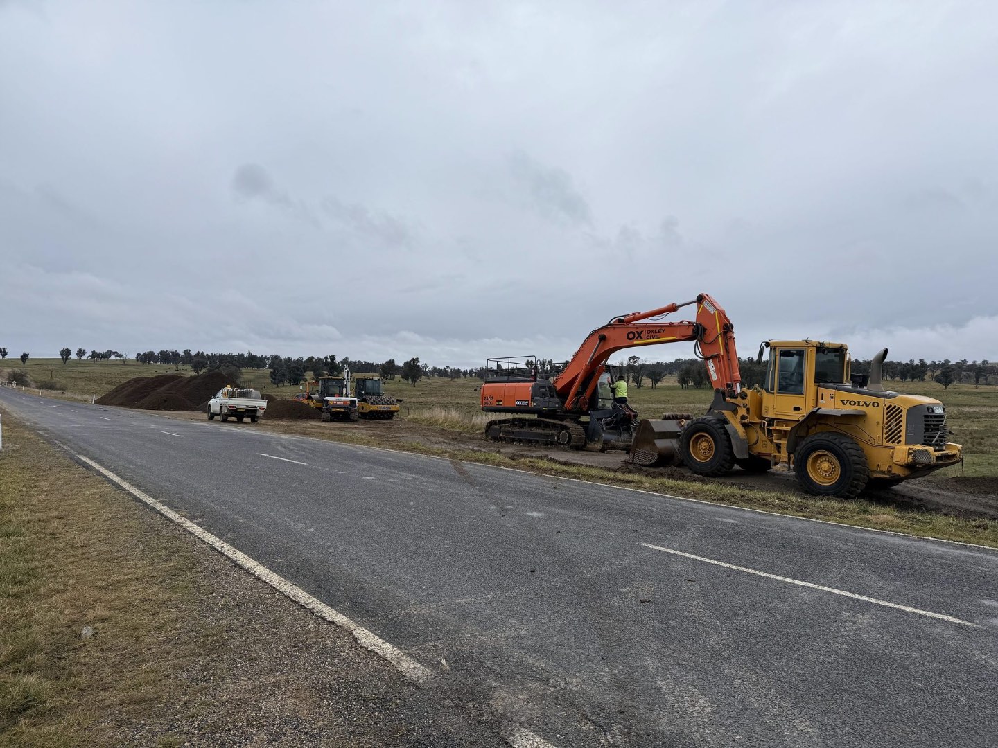 Excavator and loader at the roadside