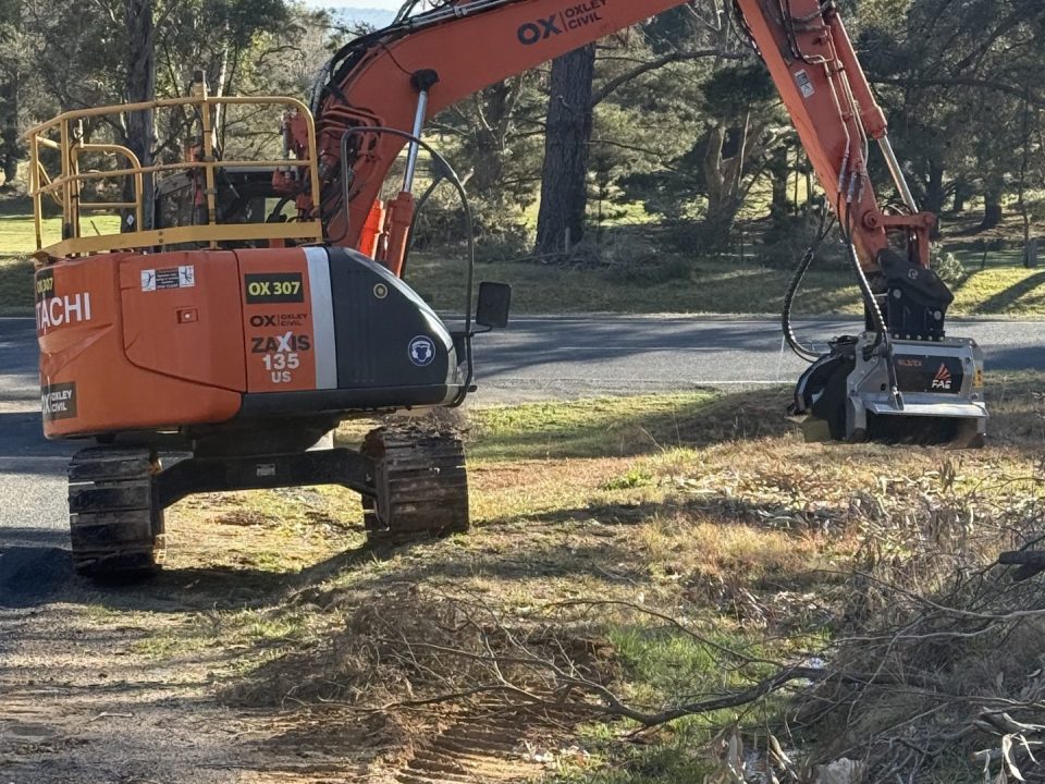 Zaxis 135 mulching a road verge