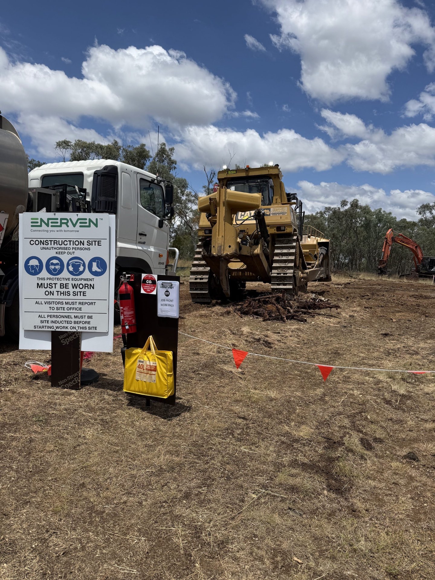 Site induction signage and dozer